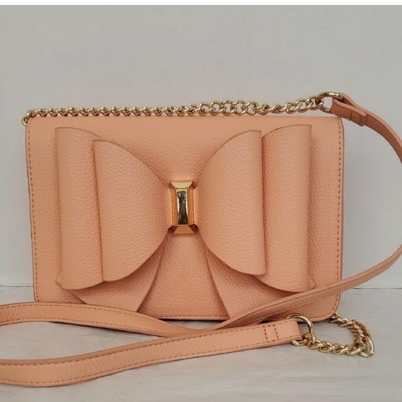 Crossi Handbags - Elegant Peach Crossbody Bag with Bow Accent
NWOT
